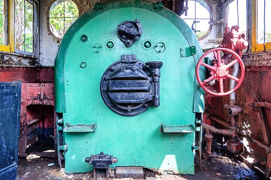 Controls in the cabin of a vintage steam locomotive 