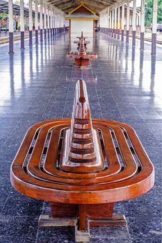 Ancient teak chairs, platform seat at railway station