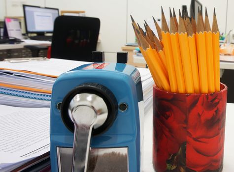 Office supplies on desk have document clip board ,document, pensil, sharpener etc.                         