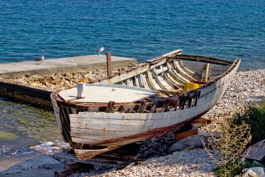 Old wooden boat broken by the sea, Dalmatian coast, Croatia