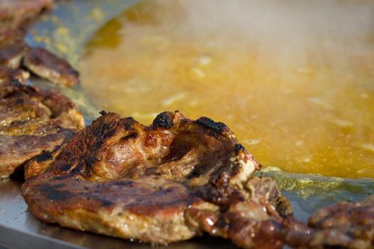 Roasted steak in traditional  croatian kotlovina dish