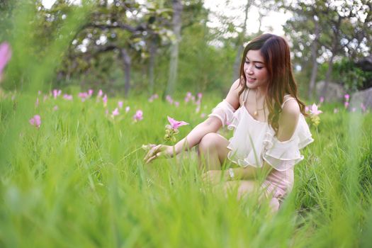 pretty asian woman in siam tulip flower field