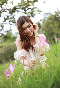 pretty asian woman in siam tulip flower field