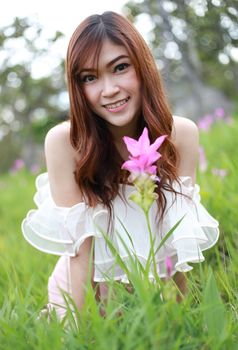 pretty asian woman in siam tulip flower field