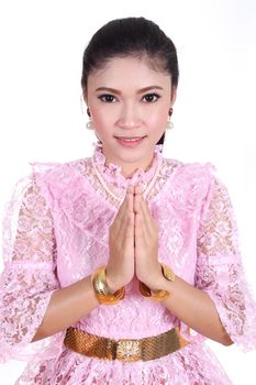 woman wearing typical thai dress pay respect isolated on white background, identity culture of thailand