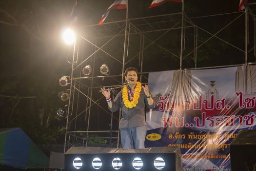 SURAT THANI, THAILAND - MARCH 3, 2014:Dr.Jak Phanchupech gives a speech during an anti-government rally on the protest stage at Chiya on March 3, 2014 in Surat Thani, Thailand.