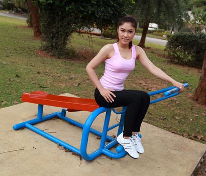 woman with exercise equipment in the public park