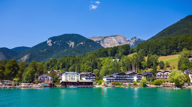 View of View of St. Wolfgang waterfront village at Wolfgangsee lake and Schafberg Peak in background, Austria