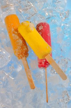 Fruit ice cream pops on ice