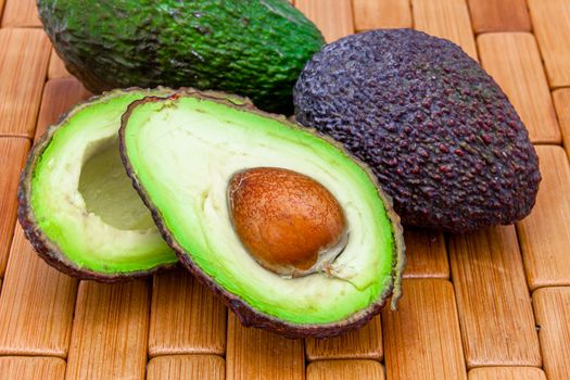 Composition of several avocados on a wood background