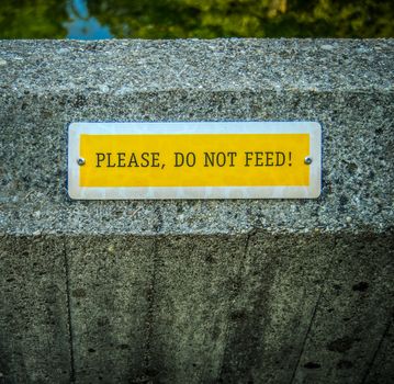 Conceptual Image Of A Do Not Feed Sign At A Zoo