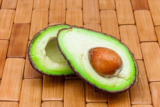 Composition of an avocado on a wood background