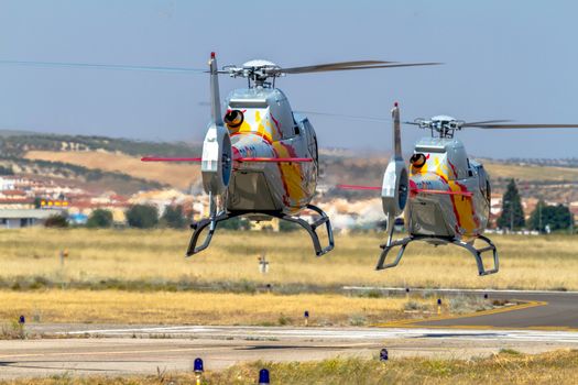 GRANADA, SPAIN-MAY 18: Helicopters of the Patrulla Aspa taking part in a exhibition on the X Aniversary of the Patrulla Aspa of the airbase of Armilla on May 18, 2014, in Granada, Spain