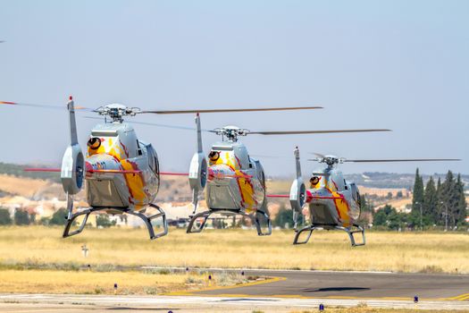 GRANADA, SPAIN-MAY 18: Helicopters of the Patrulla Aspa taking part in a exhibition on the X Aniversary of the Patrulla Aspa of the airbase of Armilla on May 18, 2014, in Granada, Spain