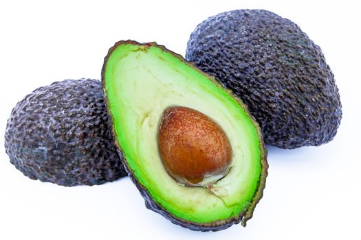 Composition of several avocados on a white background