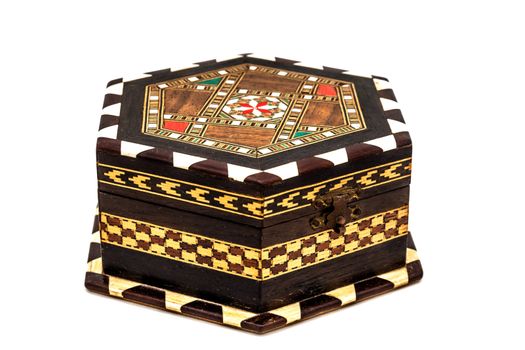 A composition of a vintage jewel box on a white background
