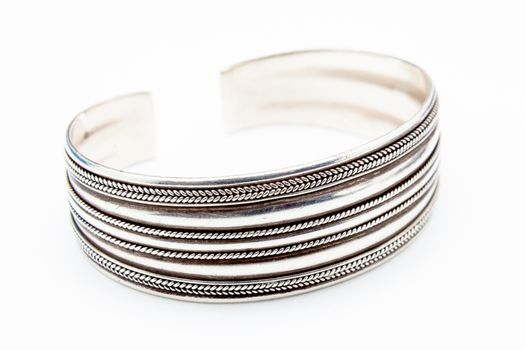 Silver fashion bracelets on a white background