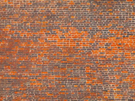 Big wall made of orange and grey bricks