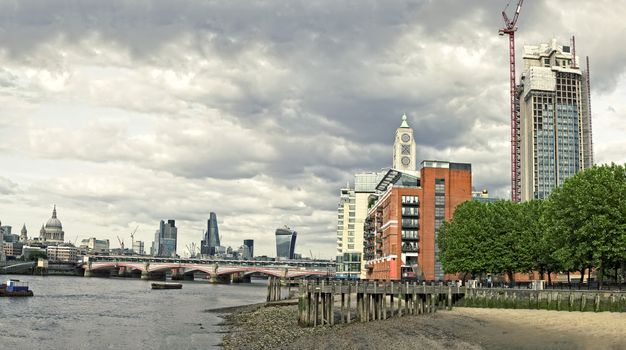 Skyline of City of London with Blackfriars Bridge over River Thames.