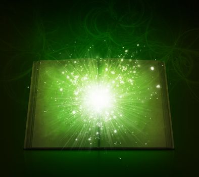 Old open book with magic light and falling stars. Dark background