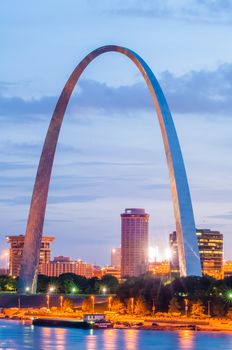 City of St. Louis skyline. Image of St. Louis downtown with Gateway Arch at twilight.