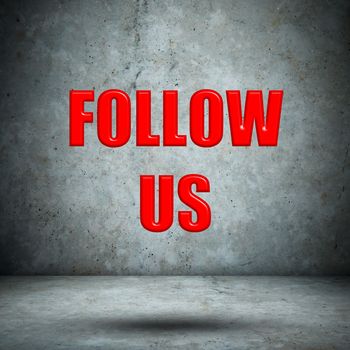 FOLLOW US on concrete wall