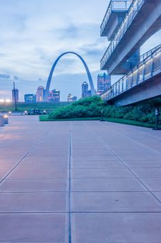 City of St. Louis skyline. Image of St. Louis downtown with Gateway Arch at twilight.