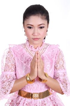 woman wearing typical thai dress pay respect isolated on white background, identity culture of thailand