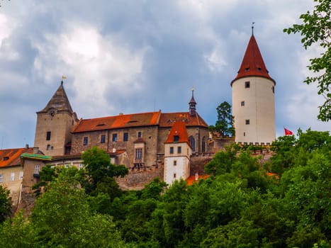 Krivoclat Castle with typical white tower and dramatic sky (Czech Republic)