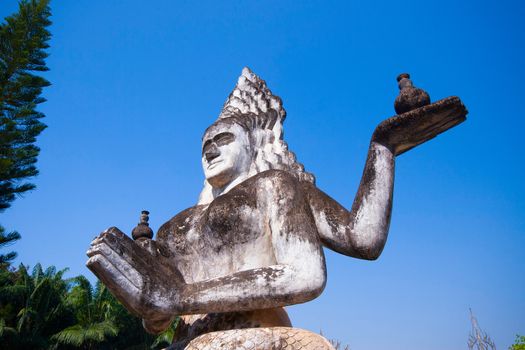 Buddha park in Vientiane, Laos. Famous travel tourist landmark of Buddhist stone statues and religious figures