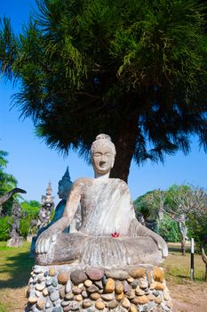 Buddha park in Vientiane, Laos. Famous travel tourist landmark of Buddhist stone statues and religious figures