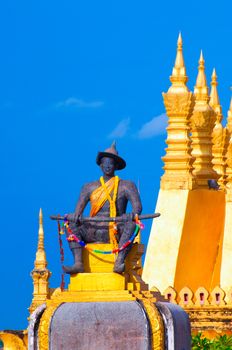 Pha That Luang, the golden stupa on the outskirts of Vientiane, Laos, that has become a national symbol for the nation. Photo taken during sunrise.