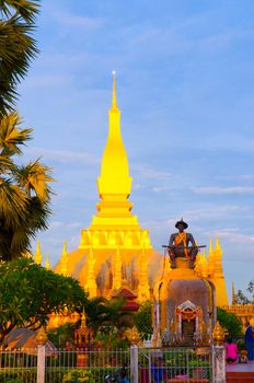 Pha That Luang, the golden stupa on the outskirts of Vientiane, Laos, that has become a national symbol for the nation. Photo taken during sunrise.