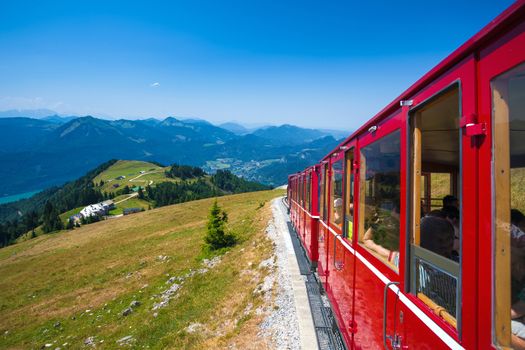 ST. WOLFGANG, AUSTRIA - AUGUST 6: Steam locomotive of a vintage cogwheel railway going to Schafberg Peak (1783m) on August 6, 2013 in St. Wolfgang.