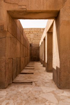 Solid stone columns and pillars underneath the statue of the Sphinx by Pyramids of Giza in Cairo Egypt