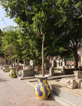 Ornate tiled plant pots line the walkways in the Greek Orthodox cemetery in Convent of St George in Coptic or Old Cairo in Egypt