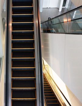 Escalators for passengers using for up or down between floors of building.                               