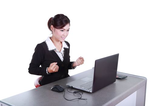 Celebrating businesswoman with laptop computer isolated on white background