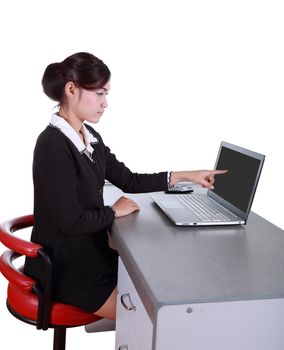 businesswoman pointing at her laptop isolated on white background