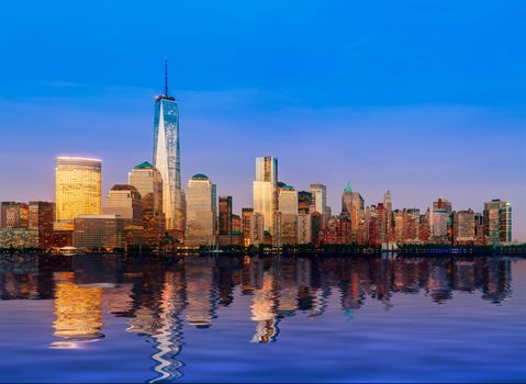 Skyline of lower Manhattan of New York City from Exchange Place at night with World Trade Center at full height of 1776 feet