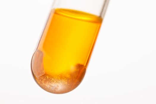 Close up of orange liquid in test tube