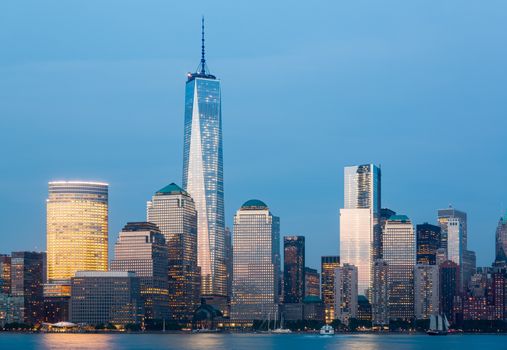 Skyline of lower Manhattan of New York City from Exchange Place at night with World Trade Center at full height of 1776 feet
