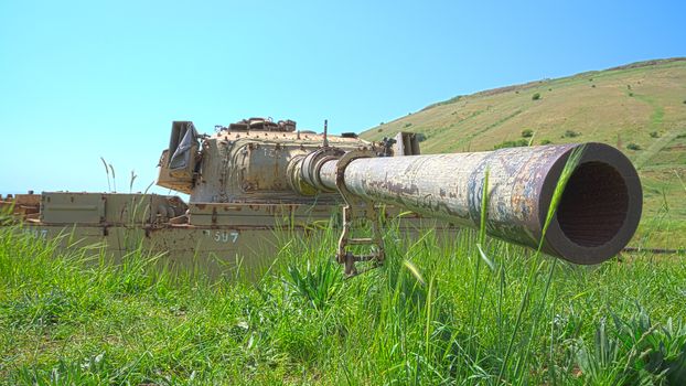 Rusty tank turret with large caliber cannon. HDR shot.