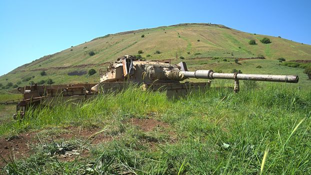 Derelict old Israeli tank on Golan Heights emplacement. HDR photo.