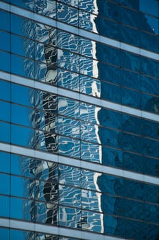 abstract architecture - windows and clouds reflexion