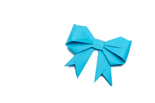 blue origami paper bow on white paper background