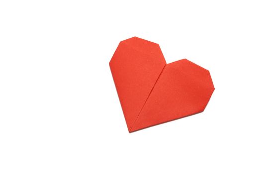 red origami paper heart on white paper background