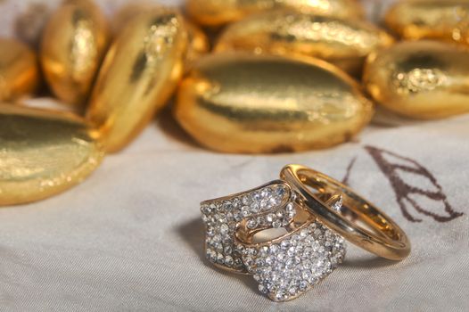  wedding rings on  a colorful fabric background