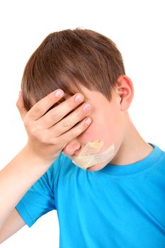 Sad Kid with sealed Mouth Isolated on the White Background