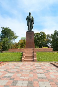 Taras Shevchenko monument in Shevchenko park, Kyiv, Ukraine under blue sky